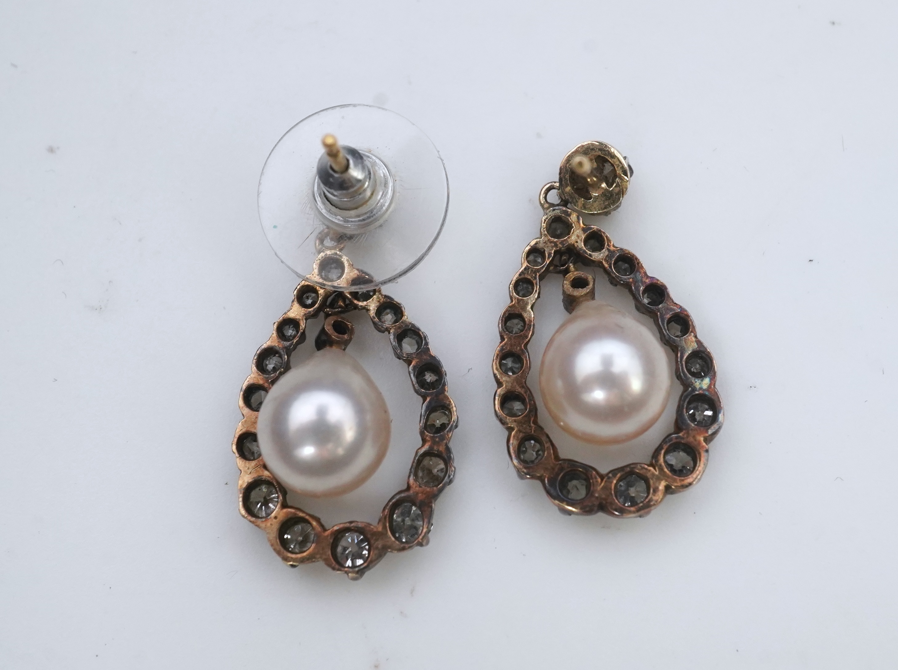 A pair of cultured pearl and diamond earrings